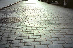 Photo of Mercer Street at night showing the beutiful Belgium Block road